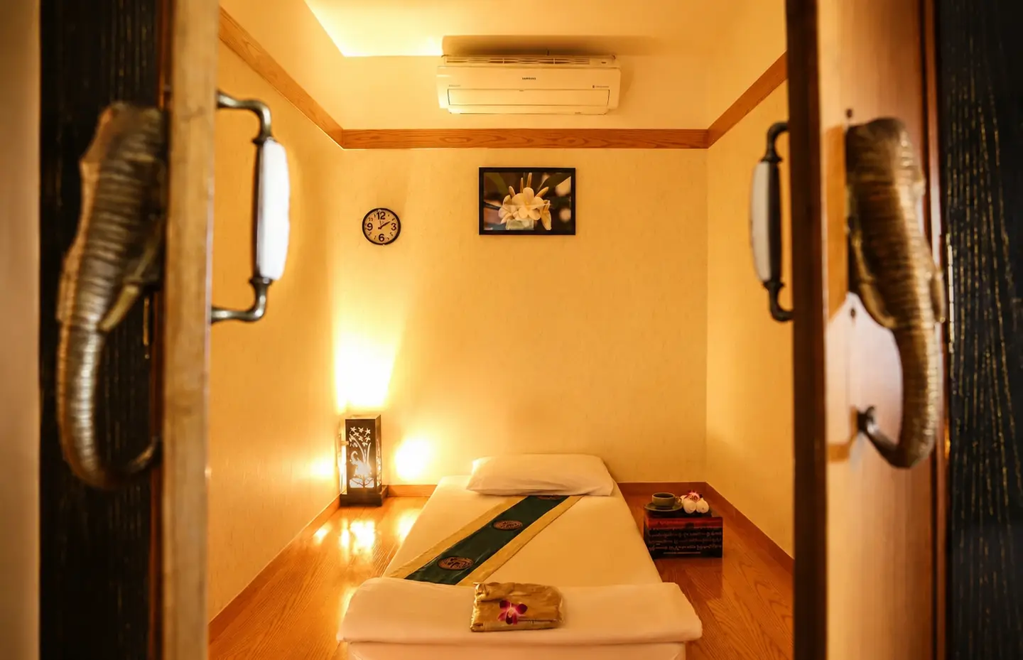 A warm, lamplit treatment room at Ananda